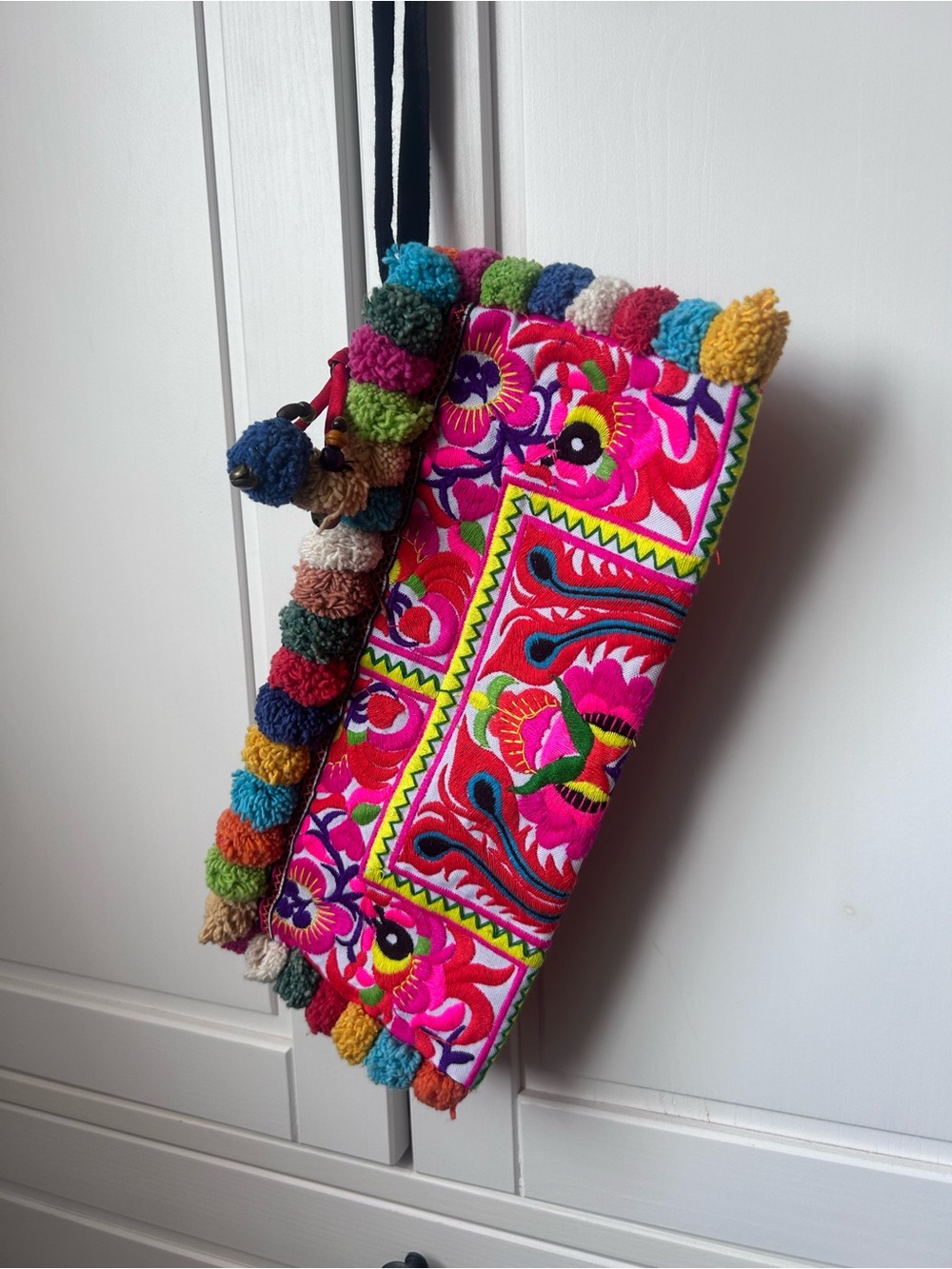 Colorful Embroidered wristlet with Pom Poms